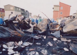 5th Avenue Alex shacks after fire; new empty flats behind